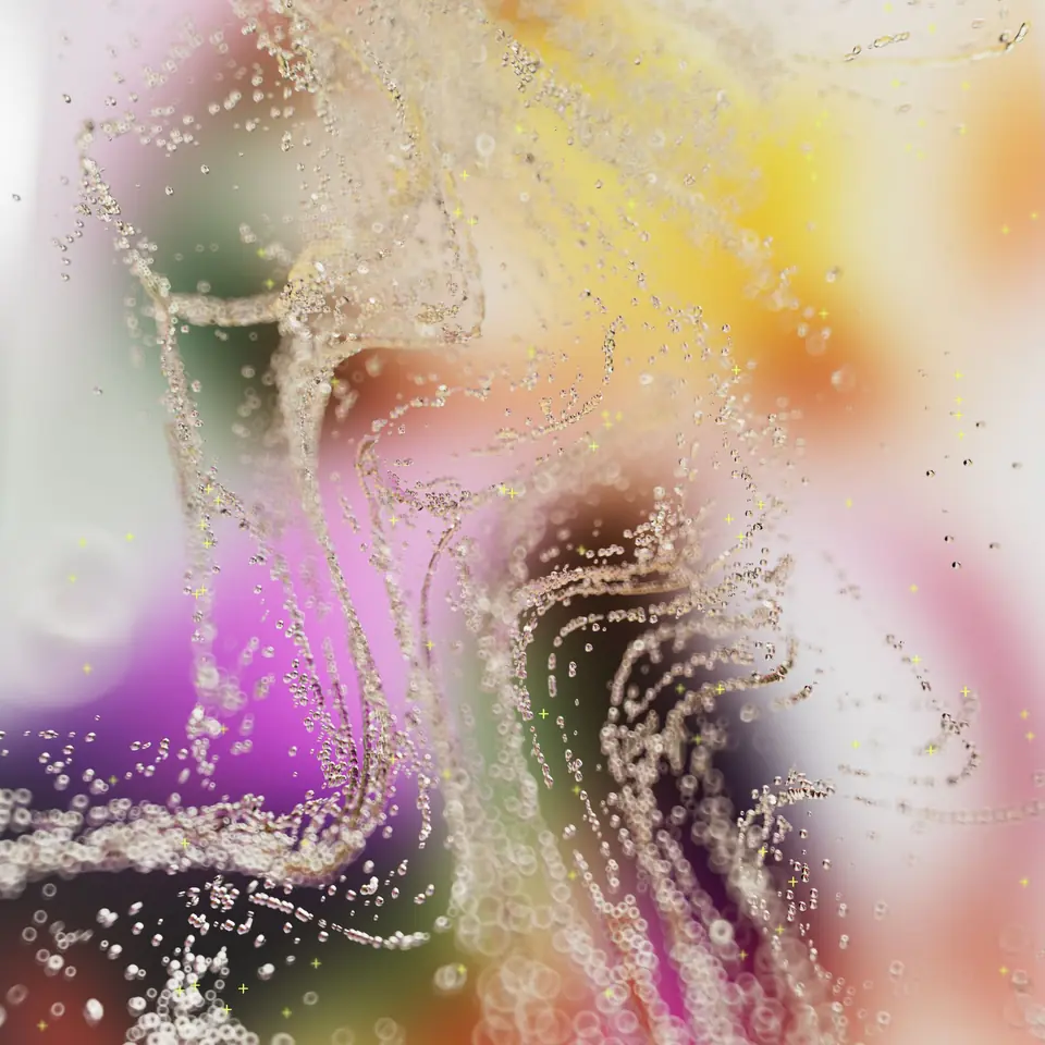 Abstract render of glittering bubbles and swirls in pink, yellow and violet