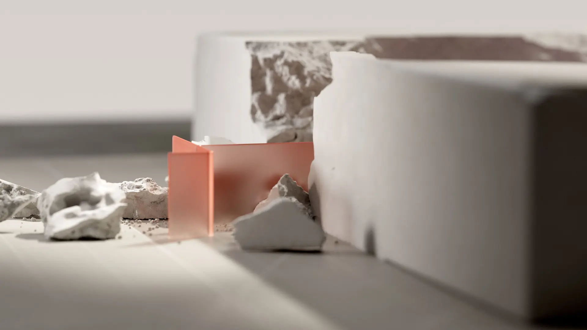 Abstract render of concrete chunks beside a peach-coloured acrylic panel
